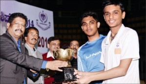 State Championship Badminton 2014 Under 17 Boys doubles winners Raghu of Mysore and Mithun Manjunath of Bangalore are seen receiving their prize from Karnataka Badmintion Association Vice President S.G. Prabhu as MLA Vasu, City Police Commisioner Dr. M.A. Saleem and Mysore Hotel Owners Association President Rajendra look on.