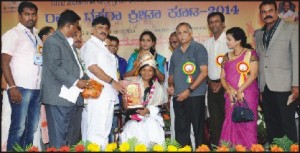 Mountaineer Arunima Sinha was feliciated by State Government during the inauguration of Dasara Sports 2014 at the Chamundi Vihar Stadium yesteday. Seen in the picture are (from left) DYES Director H.S. Venkatesh, Energy Minister D.K. Shivakumar, ZP President Dr. B. Pushpa Amarnath, Youth Empowerment and Sports Minister Abhaychandra Jain, DYES Asst. Director Suresh and others.