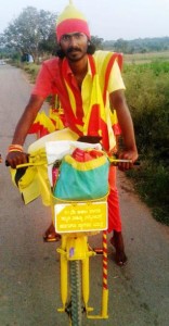 LOVE FOR KANNADA: Youth from Haveri, Gopal, spreading the message of Sahitya Sammelana through bicycle tour.
