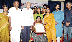 B. Anasuyamma, Vice-President of KRRS, who was conferred Prof. Vasu Malali award in city yesterday, is seen with activist K. Neela, senior writer Dr. C.P. Krishna Kumar, writer Dr. Malali Vasanthakumar and others. 