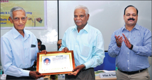 Dr. N.G. Malleshi (centre), retired Scientist G and Head, Department of Grain Science and Technology, CFTRI and a resident of CFTRI Layout in Bogadi II Stage, seen receiving the citation from Prof. Hegade, retired Director of Research, UAS, Bengaluru, at the Millet Conference held at Bengaluru recently as Dr. Vilas Tonapi, Director, ICAR-Indian Institute of Millet Research, Hyderabad, looks on. 