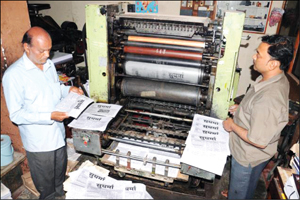 File photo: K.V. Sampath Kumar (left), Editor of Sudharma, at his press. 