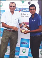 M.S. Shreyas Chandra of JWGC, Mysuru, seen receiving the Category 'A' and Combined winners trophy from Gopinath, Vice-President, Coimbatore Golf Club in the IGU Yes Bank Tamil Nadu Junior Boys Golf Championships which concluded on Friday. 