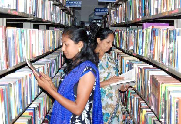 INVITING BOOK LOVERS:Readers browse at Hassan City Library.— Photo: Prakash Hassan