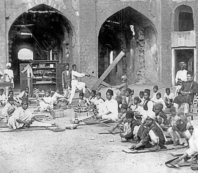 Vocational training in progress in the early 1900s in Mahmud Gawan Madrasa in Bidar. | Photo Credit: Source-Liyakath Ali Khan, Bidar
