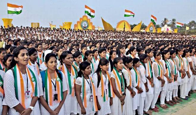 As many as 4,850 students from 23 degree colleges wearing the same badge sing Vande Mataram to enter the Golden Book of World Records on Malpe beach in Udupi on Saturday. 