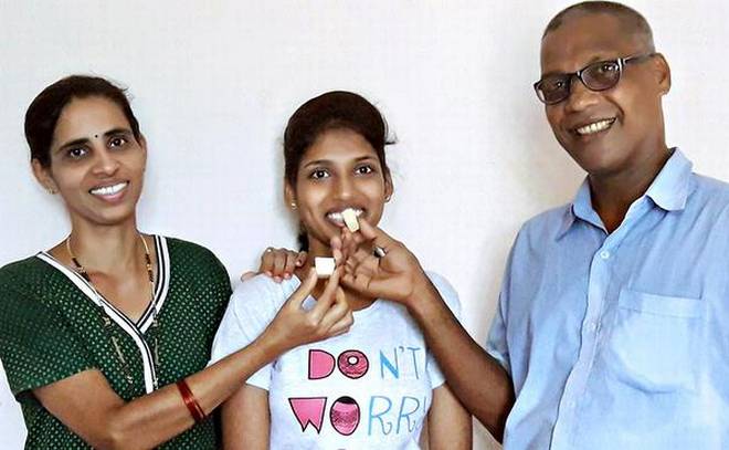 Sathyashree with parents at Ankadakatte on Monday. | Photo Credit: handout_mail