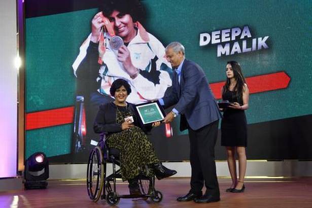 Guts and glory: Deepa Malik is presented the parathelete sportswoman of the year award by M.M. Somaya. | Photo Credit: Vivek Bendre