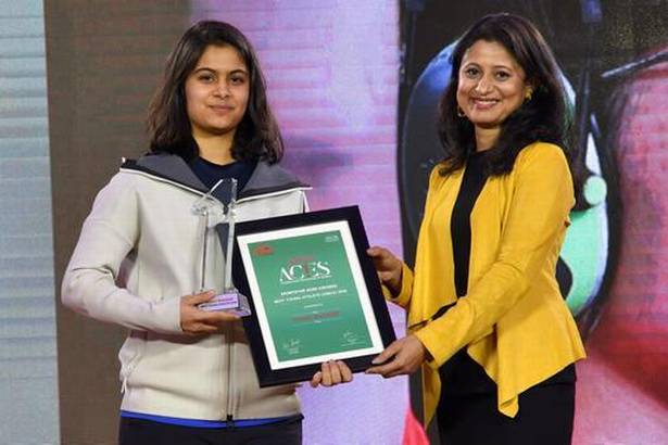 Bull's eye: The 16-year-old Manu Bhaker receives her award from ace shooter Anjali Bhagwat. | Photo Credit: Vivek Bendre