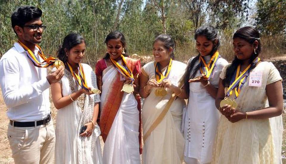 Some of the medal winners at the convocation of Kuvempu University on Friday. | Photo Credit: VAIDYA