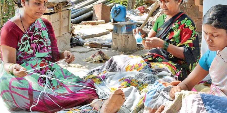 Women of Jantli Shirur village in Gadag district sew quilts outside their homes. The village is home to more than 200 families who are into this business | D Hemanth