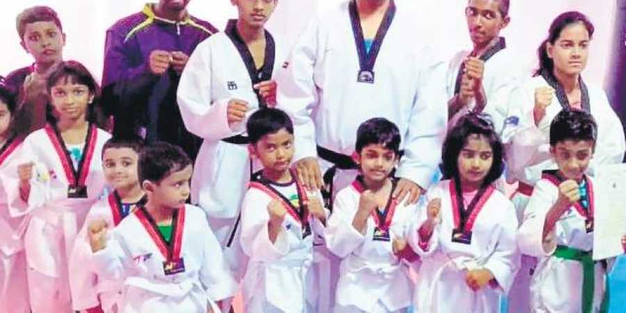 Harish S Chanakya (centre) with his Taekwondo students. (Photo | EPS)
