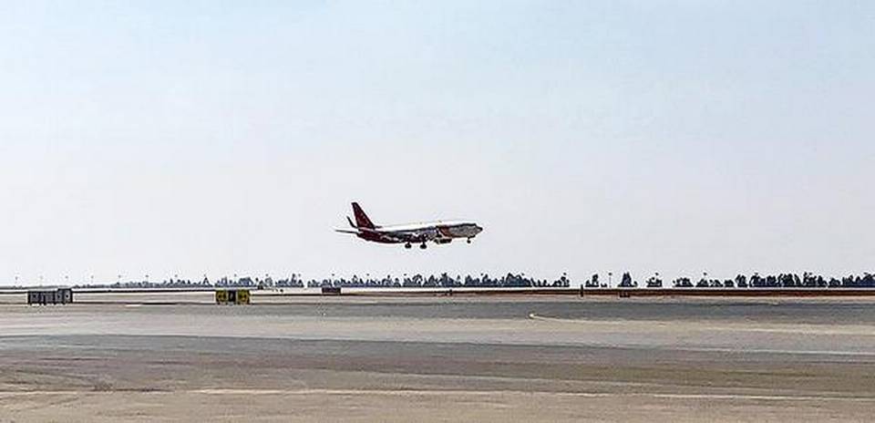 A SpiceJet flight lands on the south runway at Kempegowda International Airport in Bengaluru on Thursday. 