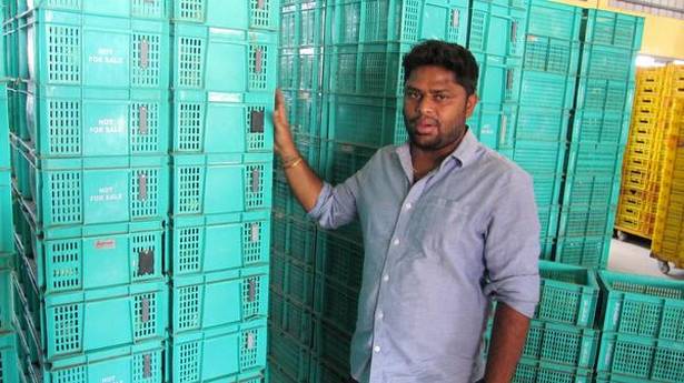 Ninjacart official Naveen Prakash Reddy showing the RFID tags fixed on the vegetable crates that will track their delivery from the centre to client seamlessly. Photo: Nahla Nainar/THE HINDU 
